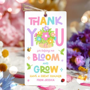 May include: A white gift tag with the words "THANK YOU" in pink and purple, and "BLOOM AND GROW" in colorful letters. A floral basket illustration is in the center. The tag includes the text "HAVE A GREAT SUMMER FROM JESSICA".