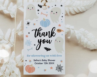 May include: A white thank you tag with a Halloween theme. It features ghosts, pumpkins, bats, and stars. The text reads "thank you for showering us with love Selina's Baby Shower October 12th 20XX".