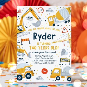 May include: A rectangular construction-themed birthday invitation featuring yellow excavators, dump trucks, and cranes. The text reads: Ryder is turning two years old! come join the crew! Saturday, May 12th at 2pm, Ryder's Construction Yard, 1234 Fore Street, Somerset MA 5678, RSVP Amy at 123-456-789.