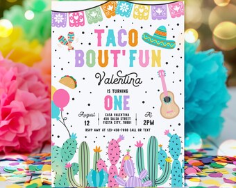 May include: A colorful invitation for a first birthday party with a taco theme. The invitation features a cactus design, a sombrero, a guitar, and the text "Taco Bout' Fun Valentina is turning One August 12 at 2PM RSVP Amy at 123-456-7890 Call or Text".