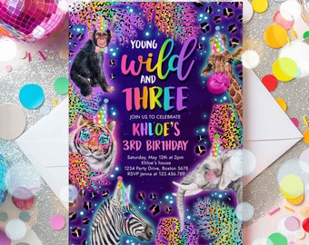 May include: Purple invitation with a rainbow 'Young Wild and Three' text for a 3rd birthday party. The invitation features a zebra, tiger, giraffe, monkey, and elephant with neon accents and a jungle theme.