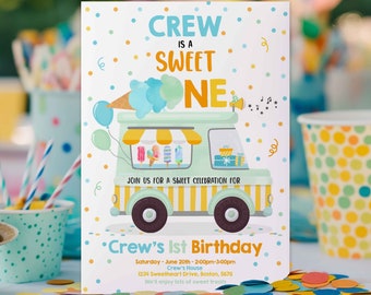 May include: A colorful invitation for a first birthday party with an ice cream truck theme. The invitation features a cartoon ice cream truck with a blue and yellow striped awning. The text on the invitation reads "Crew is a Sweet One" and includes details about the party, including the date, time, and location.