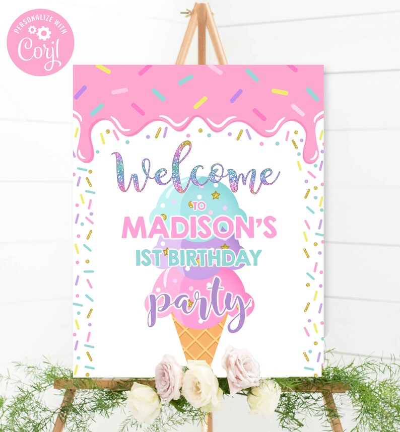 May include: A colorful party sign on an easel. The sign features a pink and blue ice cream cone design with the words "Welcome to Madison's 1st Birthday Party." Sprinkles and floral accents complete the festive look.