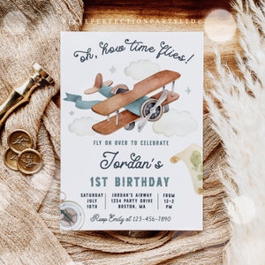 May include: A blue and white airplane themed first birthday party invitation with a watercolor illustration of a vintage airplane flying through the clouds. The text reads "Oh, how time flies!" and "Fly on over to celebrate Jordan's 1st Birthday". The invitation includes the date, time, and location of the party.