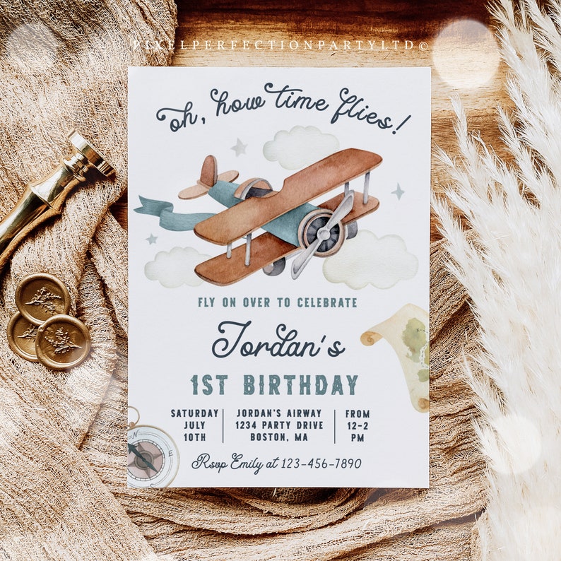 May include: A blue and white airplane themed first birthday party invitation with a watercolor illustration of a vintage airplane flying through the clouds. The text reads "Oh, how time flies!" and "Fly on over to celebrate Jordan's 1st Birthday". The invitation includes the date, time, and location of the party.