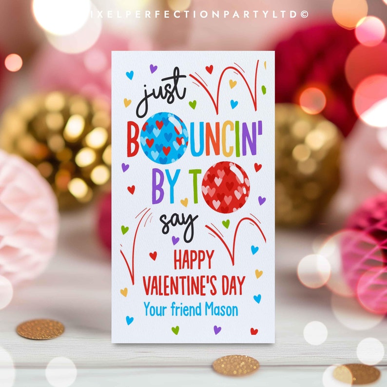 May include: A colorful Valentine's Day card with the text "just bouncin' by to say happy valentine's day your friend Mason". The card features a red, white, and blue heart-shaped balloon with a rainbow border.