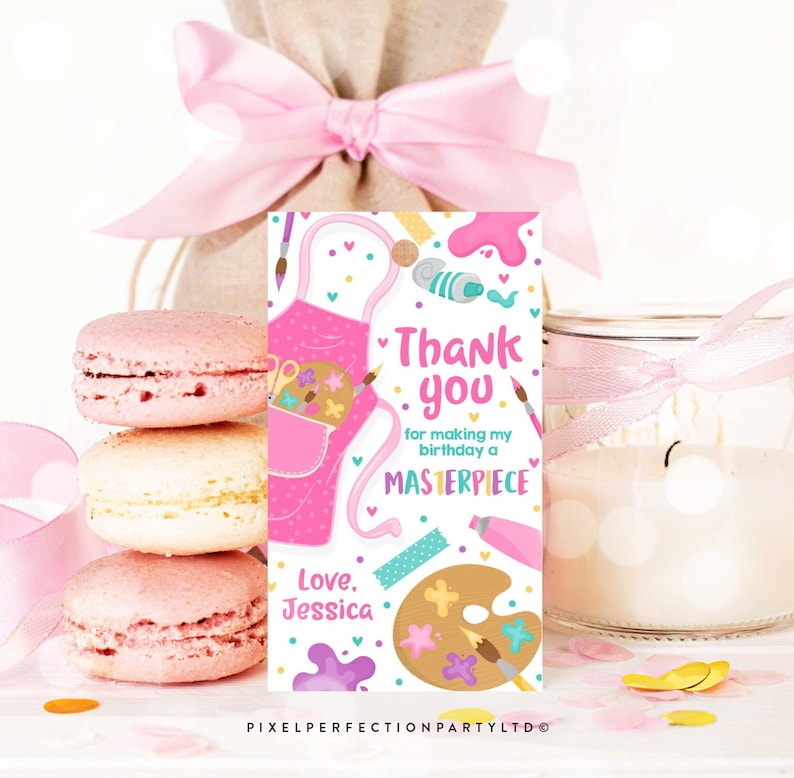 May include: Pink and white thank you tag with a pink art smock, paintbrushes, paint tubes, and a paint palette. The text reads "Thank you for making my birthday a Masterpiece. Love, Jessica."