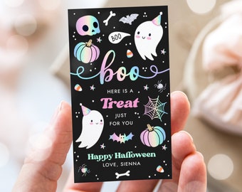 May include: A black card with a holographic rainbow design featuring ghosts, pumpkins, and candy corn. The text reads "boo" in a holographic rainbow font and "Happy Halloween, Love, Sienna".