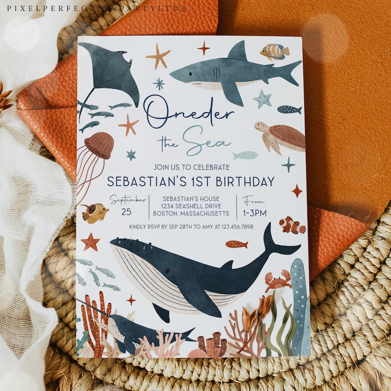 May include: A white invitation card with a blue and brown underwater theme. The text reads "Oneder the Sea" and "Sebastian's 1st Birthday". The invitation includes details for the party, including the date, time, and location.