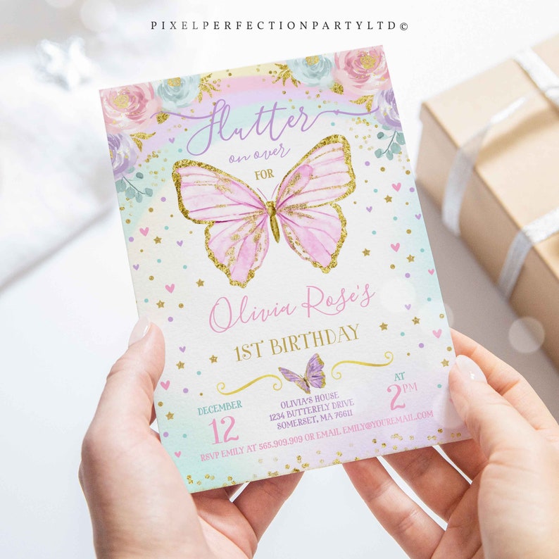 May include: A pink and gold butterfly with glitter accents on a pastel blue and pink background. The text "Flutter on over for Olivia Rose's 1st Birthday" is on the invitation. The invitation also includes the date "December 12" and the time "2 PM".
