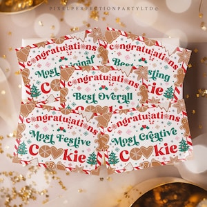 May include: Four festive Christmas cookie decorating contest award cards with red and white striped borders. The cards feature gingerbread cookies, candy canes, and Christmas trees. The text on the cards reads "Congratulations Most Original Cookie", "Congratulations Best Overall Cookie", "Congratulations Most Festive Cookie", and "Congratulations Most Creative Cookie".