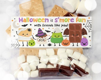 May include: A rectangular Halloween treat bag topper featuring the text "Halloween is s'more fun with friends like you!" and cartoon illustrations of a mummy s'more, a witch s'more, a candy corn, and a chocolate bar with pumpkins.