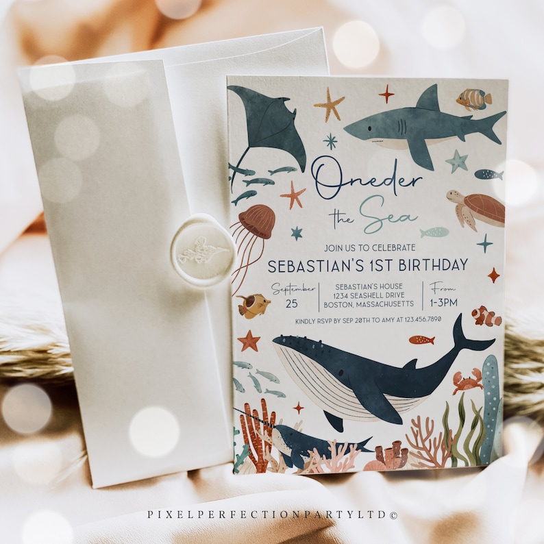 May include: A blue and white invitation card with a whimsical ocean theme. The card features a whale, a shark, a stingray, a jellyfish, a turtle, and other sea creatures. The text on the card reads "Oneder the Sea" and "Sebastian's 1st Birthday".