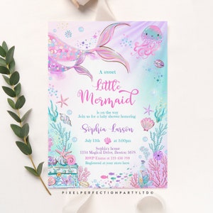 May include: A baby shower invitation with a mermaid illustration. The invitation is pink and blue with a watercolor background. The text reads "A sweet Little Mermaid is on the way. Join us for a baby shower honoring Sophia Larson. July 12th at 2:00pm. Sophia's house 1234 Magical Drive, Boston 5678. RSVP Emma at 123-456-789. Registered at your store here. PIXELPERFECTIONPARTY LTD."