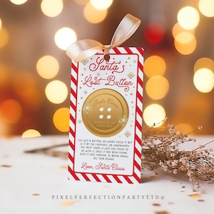 May include: A Christmas-themed gift tag featuring a gold button design, a red and white striped border, and a cream ribbon. The tag says "Santa's Lost Button" and includes a message from Santa Claus.