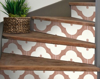 May include: A set of stair treads with a pink and white geometric pattern. The treads are made of wood and have a natural finish. A potted plant sits on the top step.