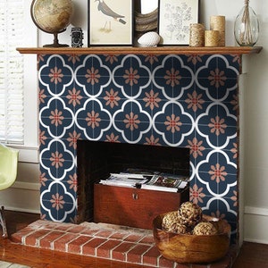 May include: A fireplace mantel decorated with blue and red patterned tiles. The tiles have a white outline and a floral design. The fireplace has a wooden mantel and a brick hearth.