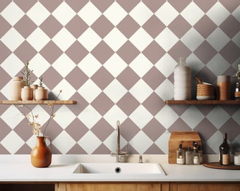 May include: A kitchen with a white and brown diamond patterned wallpaper. The kitchen features a white sink, a chrome faucet, and wooden cabinets. There are shelves with decorative items and bottles on the wall.