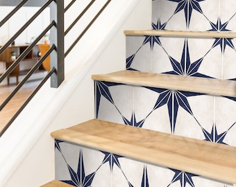 May include: A set of stair treads featuring a blue and white geometric star pattern. The stairs are made of wood and have a white trim.