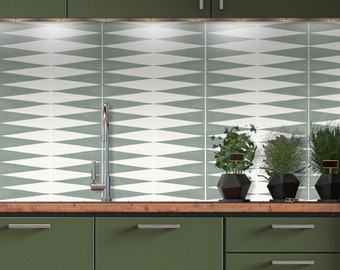 May include: A kitchen backsplash featuring green and white diamond-shaped tiles. The backsplash is situated above a wooden countertop with a stainless steel faucet. Three potted plants are on the countertop.