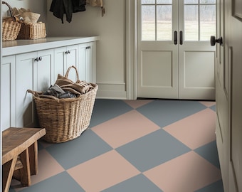 May include: A white entryway with a checkered floor in shades of gray and pink. The floor is made of tiles. There is a white cabinet with two doors and a wicker basket filled with folded clothes.