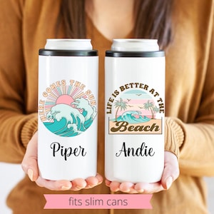 May include: Two white insulated beverage holders with colorful beach-themed designs. The left holder says "Here Comes The Sun" with a wave and sun graphic. The right holder says "Life Is Better At The Beach" with a palm tree and wave graphic. Both holders have a personalized name at the bottom.
