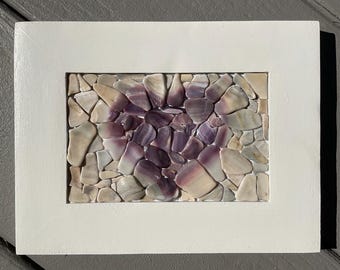 Corazón de mosaico de conchas marinas