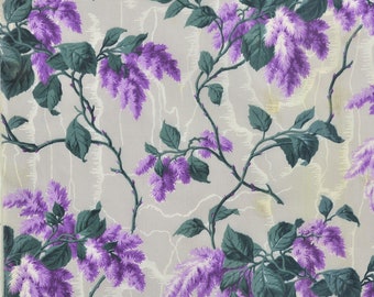 May include: A repeating pattern of purple flowers and green leaves on a light gray background. The flowers are stylized and resemble lilac blossoms.