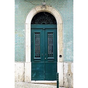 May include: A green wooden door with a decorative iron grate and a white archway. The door is set against a background of blue and white patterned tiles.