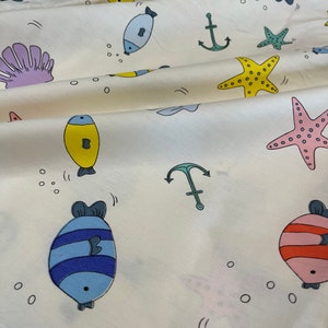Fish, sea stars, sea shells kids cotton Fabric Light cream Color. Under the sea pattern cotton. Great Quality.