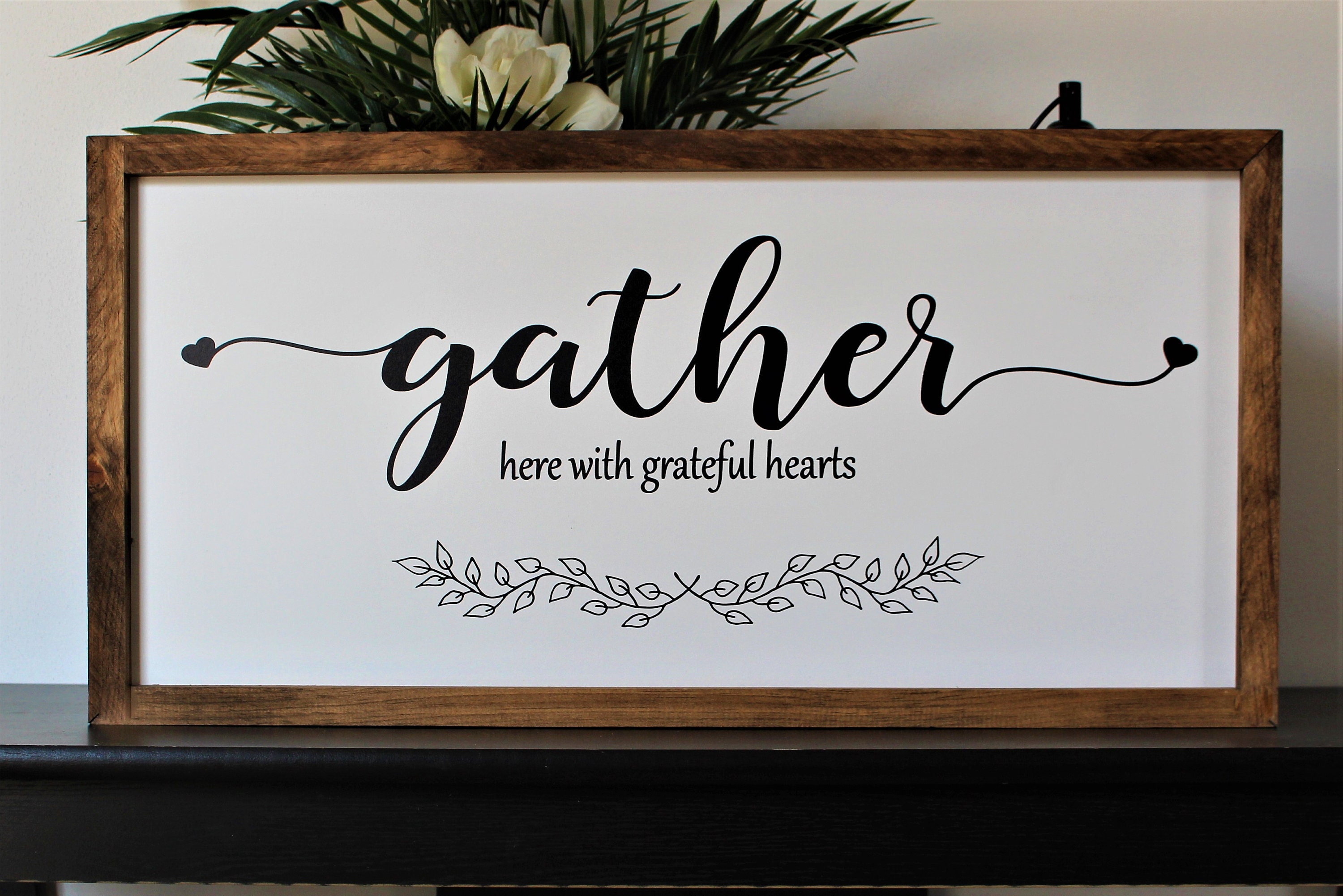 gather sign living room