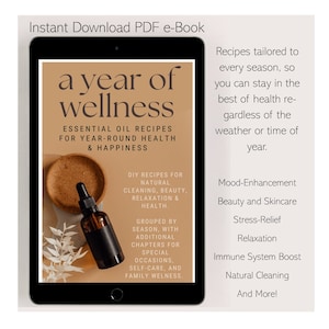 Könnte beinhalten: Ein digitales Tablet zeigt ein Buchcover mit dem Titel "a year of wellness" und dem Untertitel "Essential Oil Recipes for Year-Round Health & Happiness". Das Cover zeigt eine braune Flasche mit ätherischem Öl und eine grüne Pflanze.