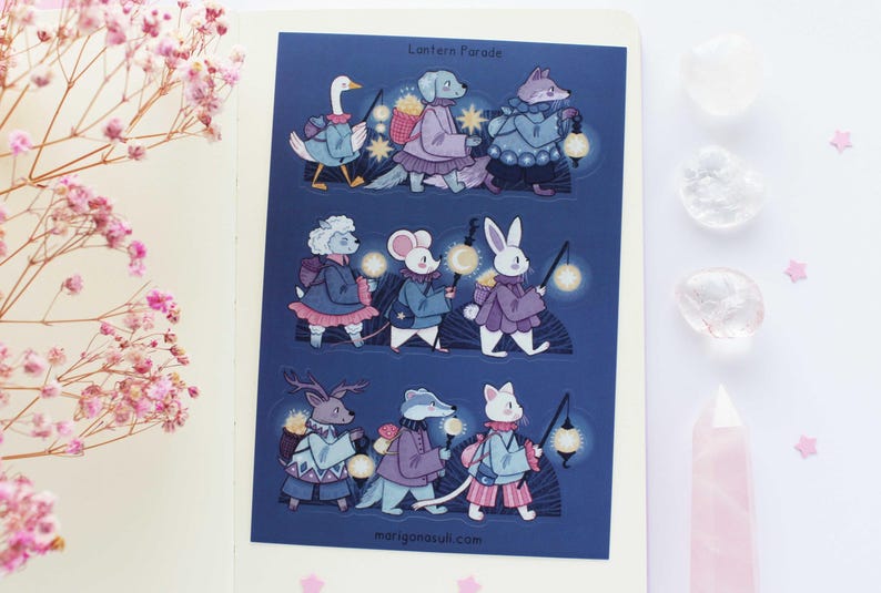 May include: A sheet of stickers featuring a lantern parade of animals. The animals include a goose, a dog, a fox, a rabbit, a mouse, a deer, a badger, and a cat. The animals are all wearing clothes and carrying lanterns. The stickers are on a blue background with the text "Lantern Parade" at the top.
