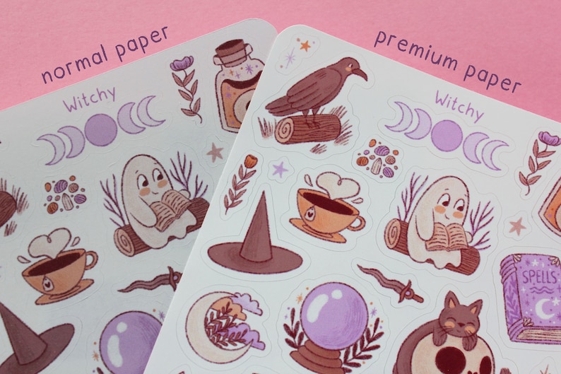 May include: Two sheets of stickers with a witchy theme. The stickers feature illustrations of a ghost reading a book, a crow on a log, a witch's hat, a crystal ball, and other mystical elements. The text "normal paper" and "premium paper" is visible.