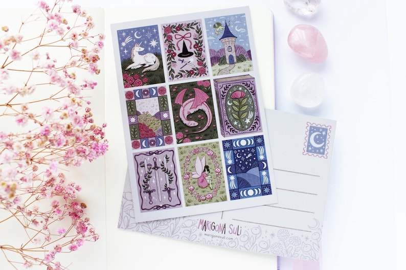May include: A sheet of nine illustrated cards with fantasy themes, including a unicorn, dragon, and fairy. The cards are in a grid pattern with a white background. A postcard with a crescent moon stamp is also visible.