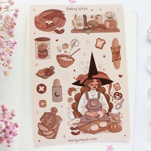 May include: A whimsical illustration titled "Baking Witch" featuring a witch with long brown hair and a black hat, baking bread. The image includes various baked goods, a sleeping dragon, and the website marigonasuli.com.