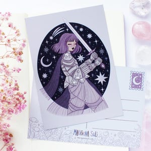 May include: Illustration of a female knight with a sword, set against a starry night sky. The artwork uses purple and grey tones. A postcard with a moon stamp is also visible.