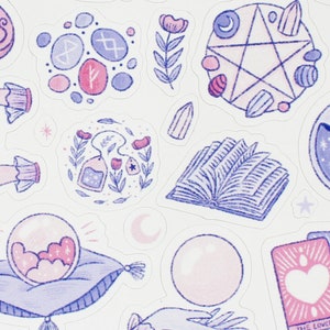 May include: A collection of whimsical stickers featuring celestial and mystical designs. Includes a crystal ball, tarot cards, a pentagram, a crescent moon bottle, hands, and other magical elements in shades of pink and purple.