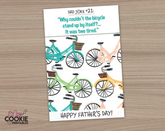 May include: A Father's Day card with a dad joke about a bicycle being too tired to stand up. The card features a colorful pattern of bicycles with baskets on a white background. The text on the card reads "DAD JOKE #21: "Why couldn't the bicycle stand up by itself?... It was two tired." HAPPY FATHER'S DAY!"