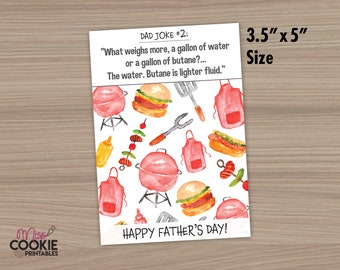 May include: A white card with a watercolor illustration of a grill, hot dogs, hamburgers, and other barbecue-themed items. The card has the text "DAD JOKE #2: "What weighs more, a gallon of water or a gallon of butane?... The water. Butane is lighter fluid." 3.5" x 5" Size" and "HAPPY FATHER'S DAY!"