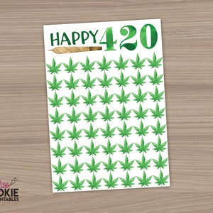 May include: A white card with the text "HAPPY 420" in green and brown. The card is decorated with a pattern of green marijuana leaves.