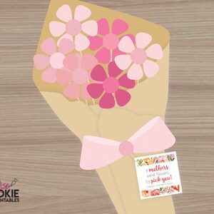 May include: A bouquet of pink and white paper flowers wrapped in brown paper with a pink ribbon and a gift tag that reads "If mothers were flowers, I'd pick you! Happy Mother's Day!"