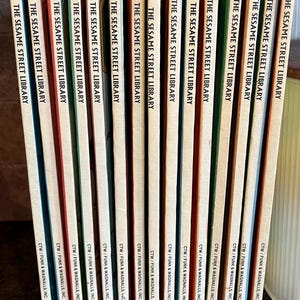 May include: A collection of vintage "Sesame Street Library" books. The spines are a mix of colors, including red, green, and yellow, with the series title and publisher's name visible. Numbers 1 through 15 are visible.