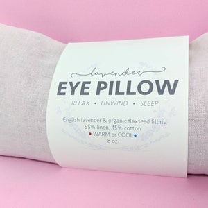 decorative front label reads lavender eye pillow relax unwind sleep english lavender and organic flaxseed filling 55 percent linen 45 percent cotton warm or cool 8 ounces