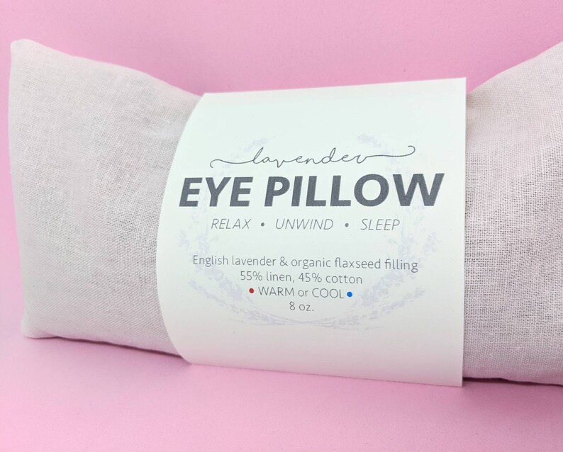 decorative front label reads lavender eye pillow relax unwind sleep english lavender and organic flaxseed filling 55 percent linen 45 percent cotton warm or cool 8 ounces