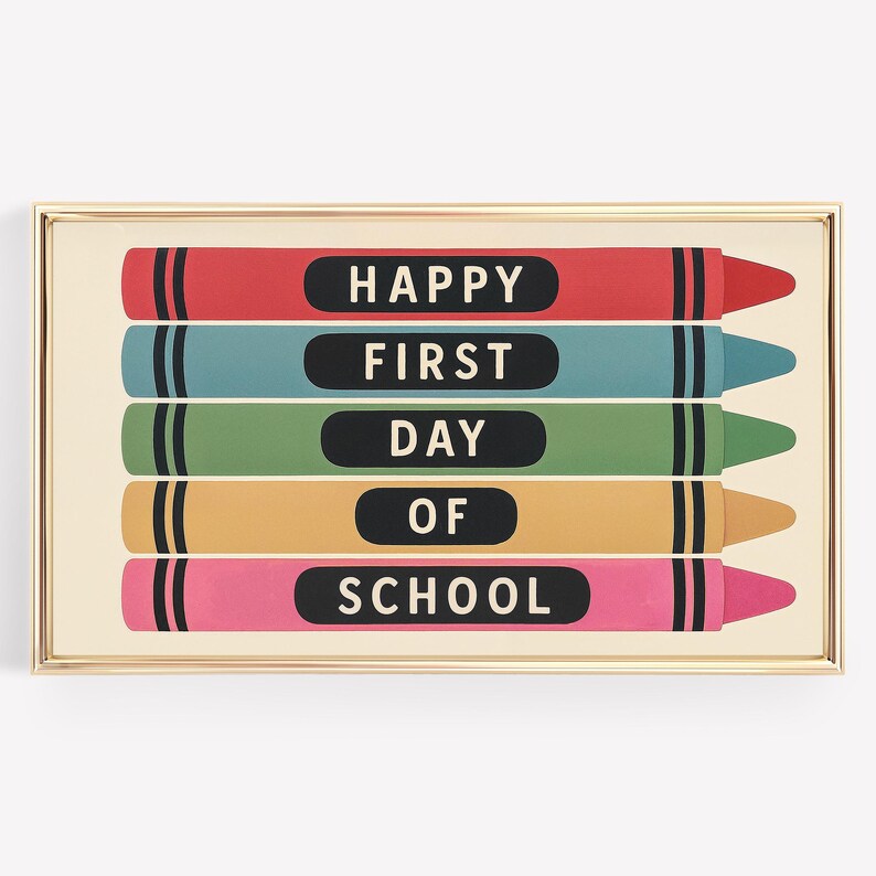 May include: A framed print featuring five colorful crayon illustrations. Each crayon is a different color: red, blue, green, yellow, and pink. The text "HAPPY FIRST DAY OF SCHOOL" is printed on the crayons in black.