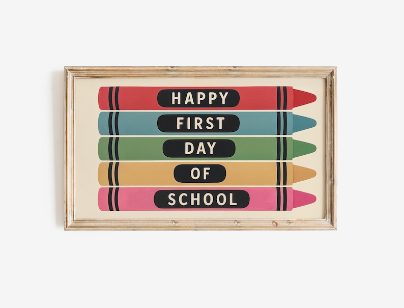 May include: A framed print featuring five colorful crayon illustrations. Each crayon has a black label with white text that reads "HAPPY FIRST DAY OF SCHOOL". The crayons are red, teal, green, yellow, and pink.