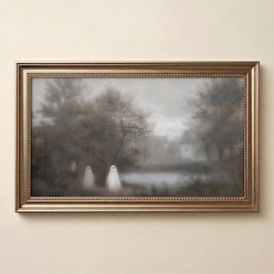 May include: A rectangular landscape painting in a metallic bronze frame featuring a misty, muted forest scene with a pond. Two white, sheet-covered ghost figures stand in the foreground among dark, hazy trees and foliage under a gray sky.