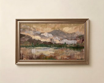 May include: A rectangular landscape painting in a metallic bronze frame featuring an impressionistic scene of mountains, a body of water, and earthy foreground vegetation rendered in muted tones of brown, green, beige, and soft white.