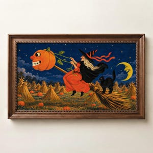 May include: A framed wall art print depicting a witch in a red dress and black hat riding a broomstick with a smiling pumpkin head attached to the front. A black cat sits on the broom handle above a field of haystacks and pumpkins under a crescent moon.